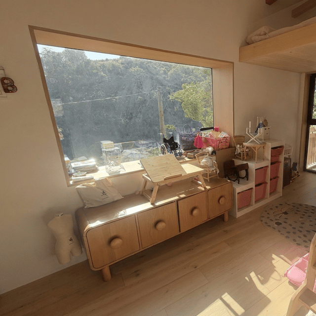 remove all of the items under the window that are on the floor of this room