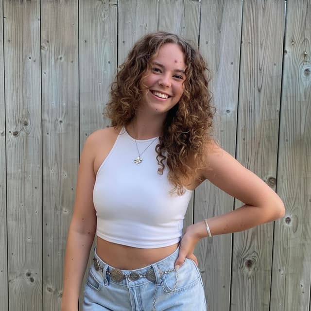 Can you make sure that the arm on the right is on my hip, instead of behind my back? Leave the rest of the image exactly how it is now
