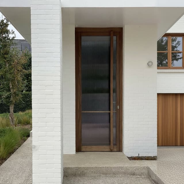 Please make from the two first pictures, make it the same but the brickwall needs to be as on the painted picture in a kind of stuck, chalk paint, make the frontdoor as on the picture with the wooden door with glass en make all the windows and the garage in the same wood as used for the frontdoor so that we have a clear view of what it will become