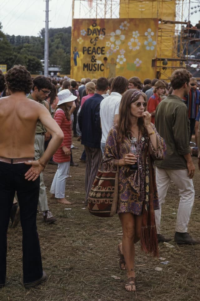 A crowded 1969 music festival scene generated from a written description